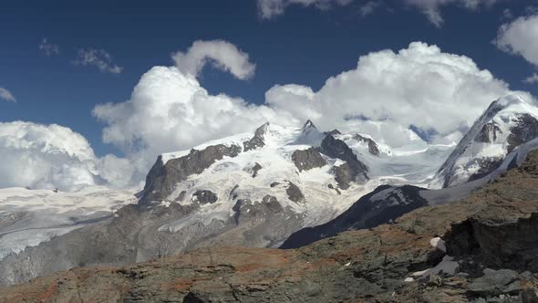 Clouds. Mountain Valley at the Swiss Alps, Switzerland.