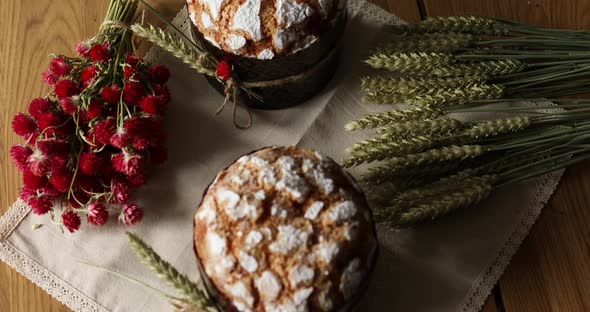 Easter cake with rustic decoration, wheat on wooden table the holiday