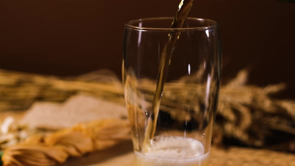 Close Up of Pouring Beer From Bottle Into a Glass