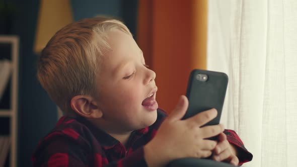 Caucasian Preschooler Smiling Posing in Front of the Camera While Making Photos