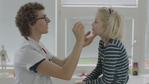 Boy Patient Being Tested For Coronavirus By Doctor