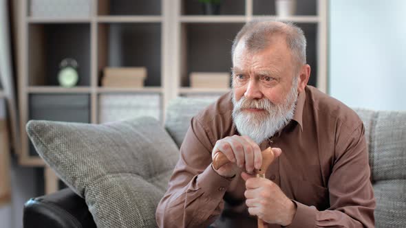 Stressed Elderly 80s Grandfather Worried About Health Problem and Loneliness at Nursing House