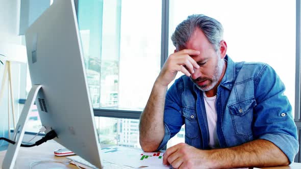 Worried male executive shaking his head