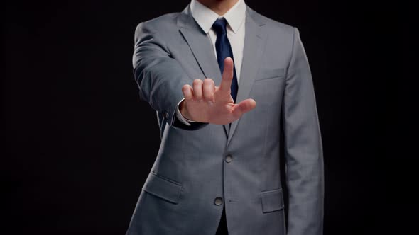 Studio portrait of successful and smart businessman in suit and tie.