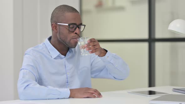 African Man Drinking Water Work