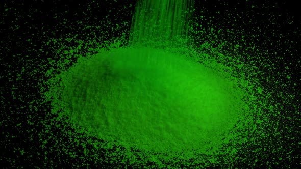 Green Granules Pour Into Pile