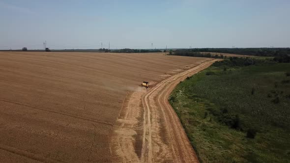 Aerial View of Combine Harvesters Agricultural Machinery. The Machine for Harvesting Grain Crops.
