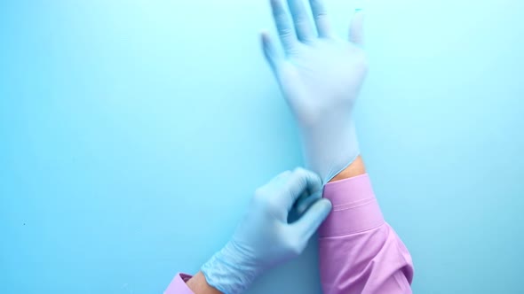 Man Doctor Wears Medical Gloves Close Up