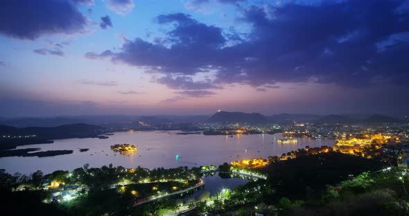 Sunset view of Udaipur city skyline and lake Pichola time lapse.