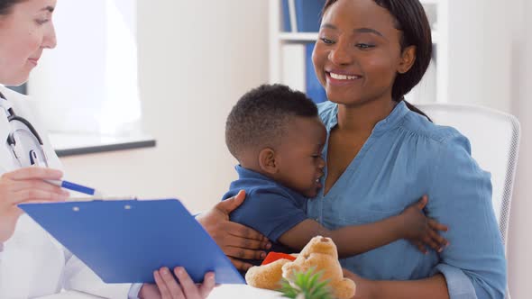 Mother with Baby Son and Doctor at Clinic