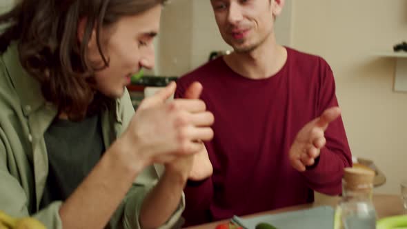 Two Lovely Men are Laughing and Holding Their Hands