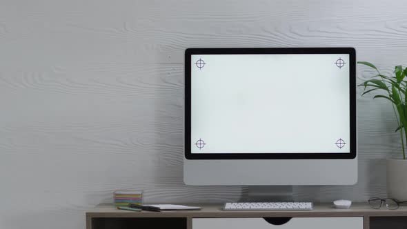 Video of computer on wooden table with copy space in office