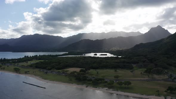 Wide aerial panning shot of an ancient coastal fishpond on the island of O'ahu, Hawaii. 4K