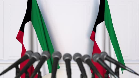 Kuwaiti Official Press Conference with Flags alt