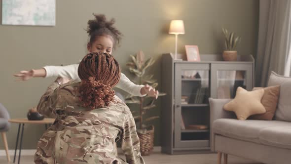 Military Woman Returning Home from Army alt