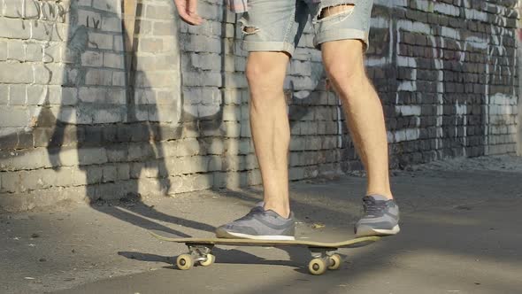 Skinny Teenager Learning to Keep Balance on Skateboard, Youth Movement, Hobby