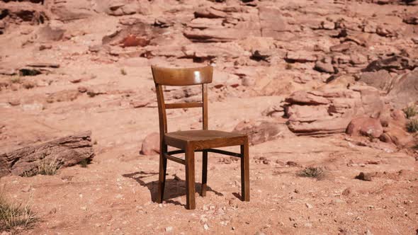 Old Wooden Chair on Rocks of Grand Canyon