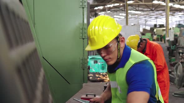 Smart Factory Worker Using Machine in Factory Workshop