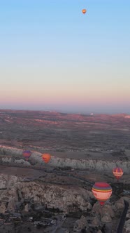 Vertical Video of Hot Air Balloons Flying in the Sky Over Cappadocia Turkey