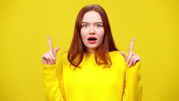 Surprised Excited Young Woman Making I Got an Idea Gesture and Shaking Head Yes Looking at Camera