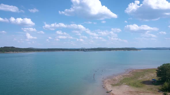 Aerial shots of a lake park in Texas on the popular Canyon Lake while barely any boats are cruising