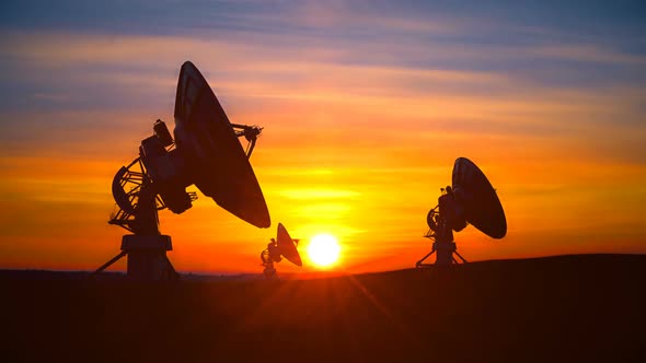 Three Radio Telescopes Against Scenic Sunset Exploring Evening Sky alt