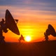 Three Radio Telescopes Against Scenic Sunset Exploring Evening Sky - VideoHive Item for Sale