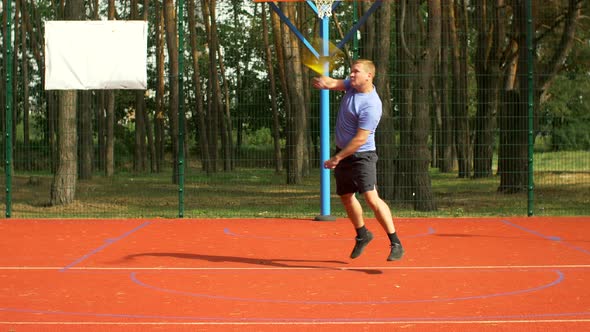 Man Playing Tennis Match Hitting Forehand on Court