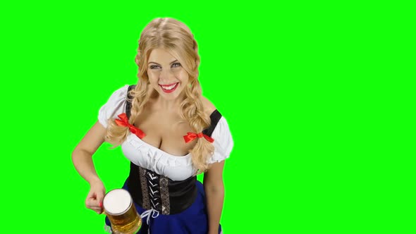 Woman in Bavarian Costume Gives Someone a Beer on Oktoberfest. Green Screen