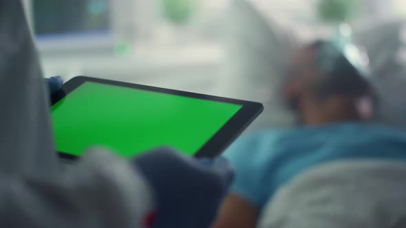 Doctor Using Pad Chroma Key Screen Closeup