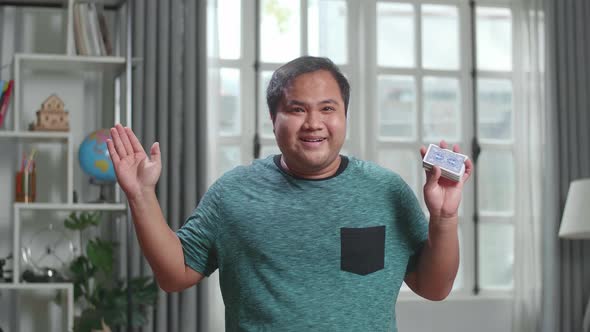 Asian Man Blogger Shoots Video Content For Social Networks, Magician With Playing Cards