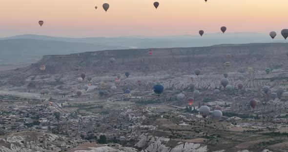 Aerial Cinematic Drone View of Colorful Hot Air Balloon Flying Over Cappadocia