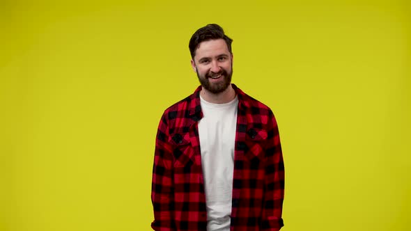 Portrait of a Young Man Looking at the Camera and Smiling