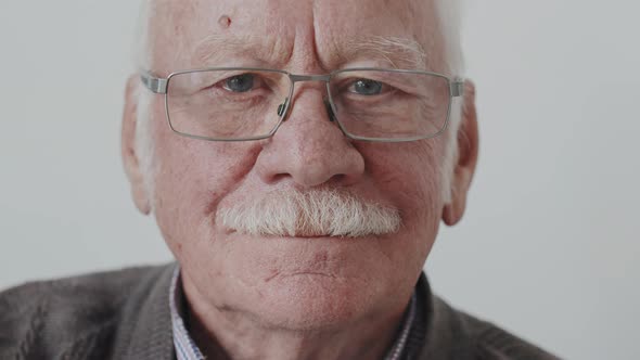 Close Up of Smiling Senior Man with Moustache