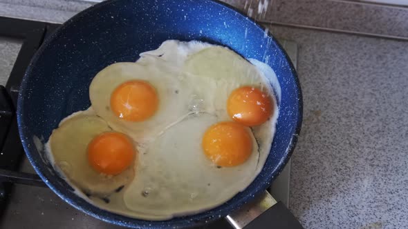 Home Breakfast. Fried Eggs Are Cooked in a Pan in the Home Kitchen