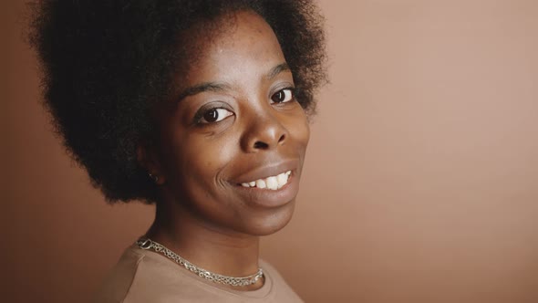 Cheerful Black Woman Posing for Camera with Smile