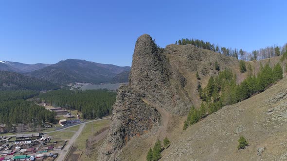 Mountain Landscape With Two People At Rock Top