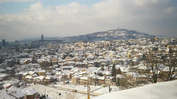 Panoramic overview of Sarajevo filled with snow