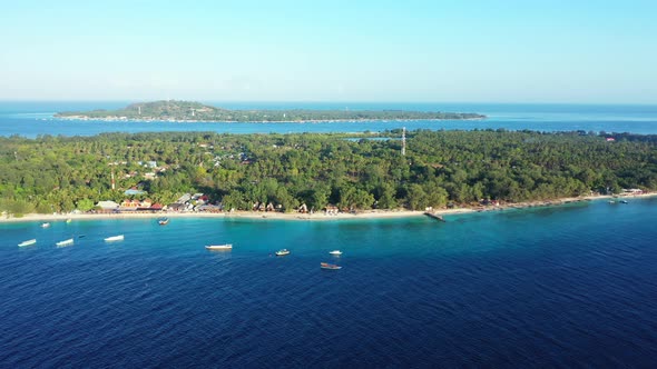 Wide angle aerial copy space shot of a sunshine white sandy paradise beach and aqua blue water backg