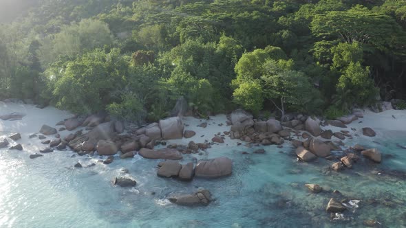 Aerial view of a person walking on the beach of Anse Lazio, Seychelles.