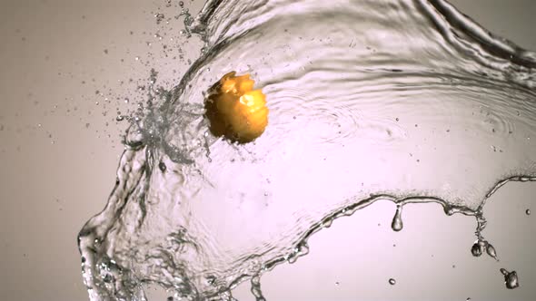 Water splash with fruit in ultra slow motion 