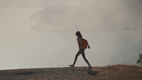 Young Woman Tourist Walks Enjoying Beautiful Seascape of Aegean Coastline Mediterranean Sea in