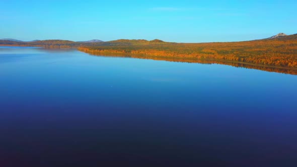 Aerial Video of Beautiful Mountain Lake on a Frosty Autumn Morning.