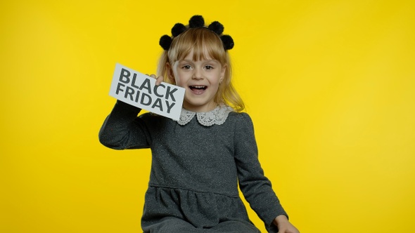 Child Girl Showing Black Friday Inscription Text Advertisement. Online Shopping with Low Prices