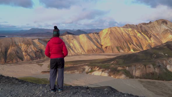 A Girl Looks at the Beautiful Landscape Landmannalaugar Nature l