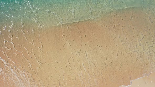 Wide angle fly over abstract view of a white paradise beach and blue ocean background in colorful 