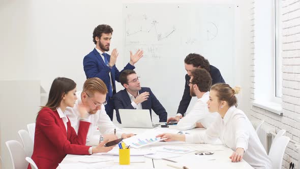 Professional Business Team Gathered in Office To Talk, Discuss Business Project