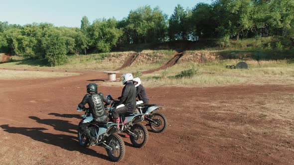 Motocross Sportsmen Chatting on Track