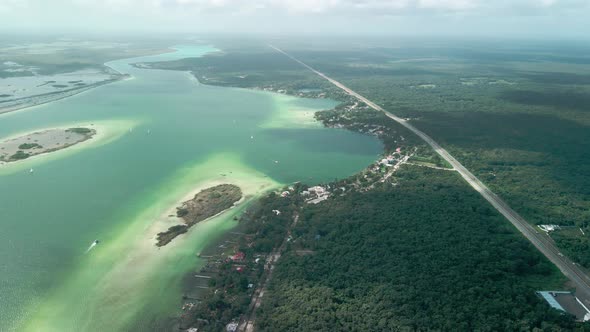 Different colors and Cenote as seen from the sky at the Bacalar Lagoon in Mexico