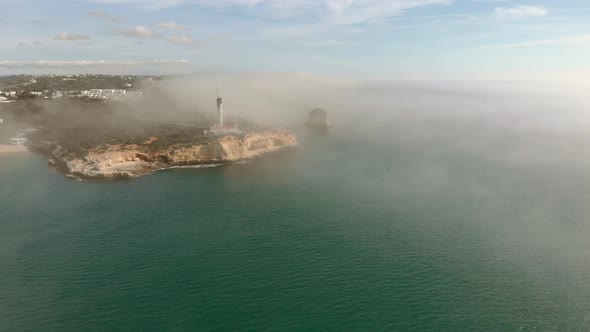 Cinematic Aerial View of Portugal Coastal Ocean Cliffs with Foggy Clouds